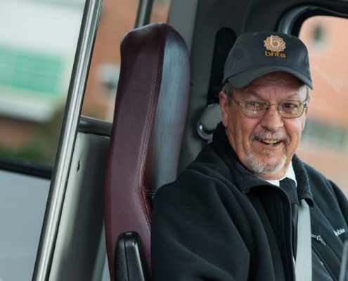 brite bus driver welcoming on passenger