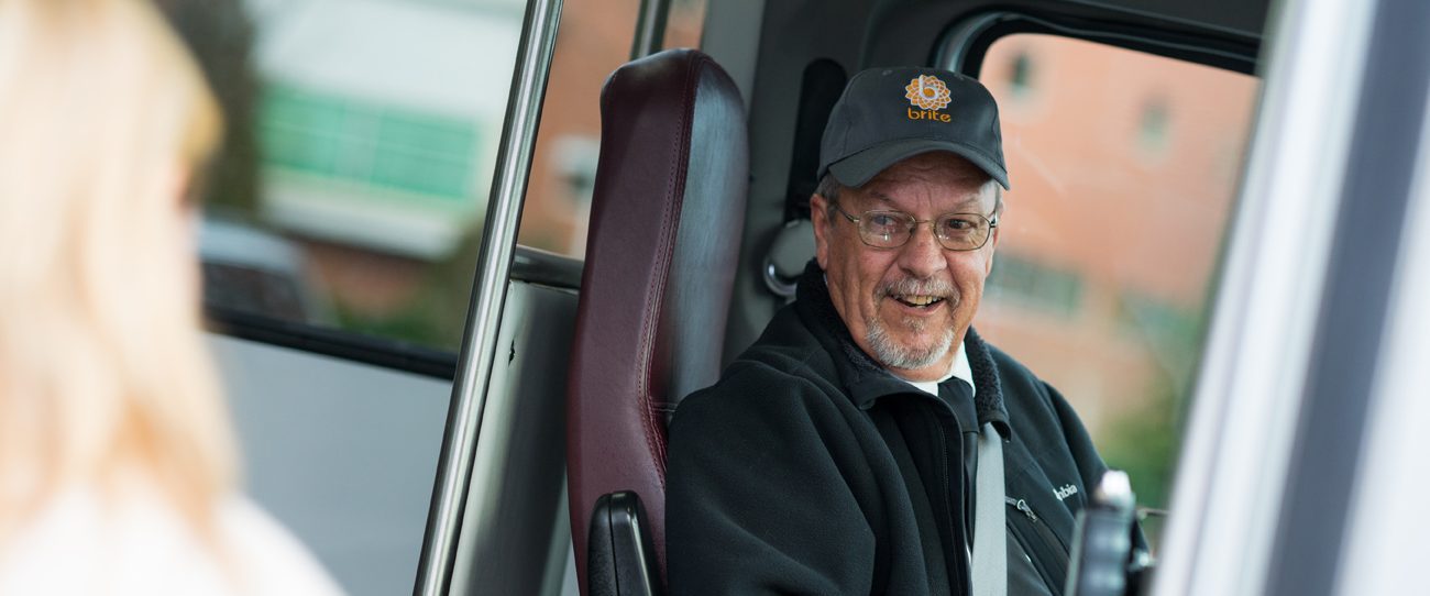 brite bus driver welcoming on passenger