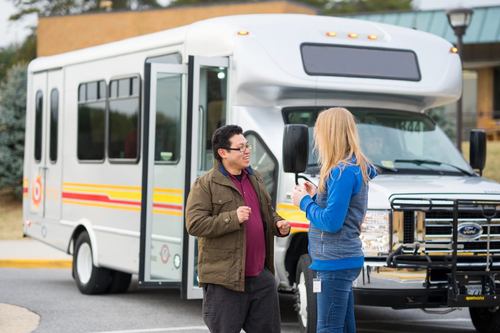 brite bus passengers talking outside of bus