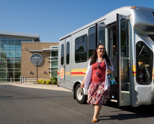 passenger getting off brite bus