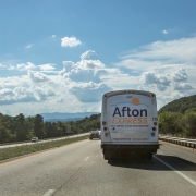 Afton Express bus driving on road