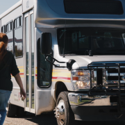 Bus Screen Shot Woman walking toward bus